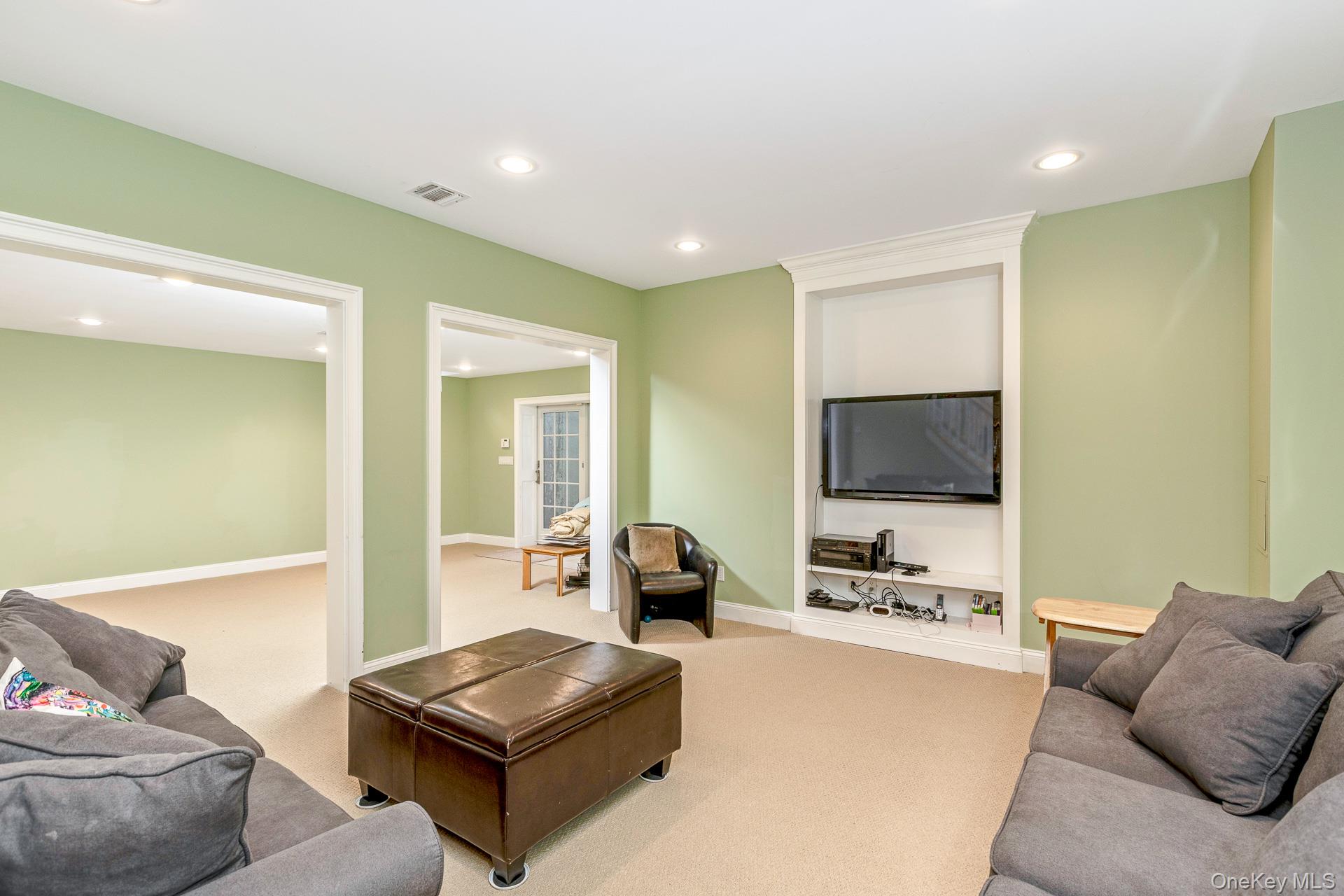 4 Martin Avenue Shoreham, NY 11786 - Photo 28 of 50 a living room with furniture and a flat screen tv
