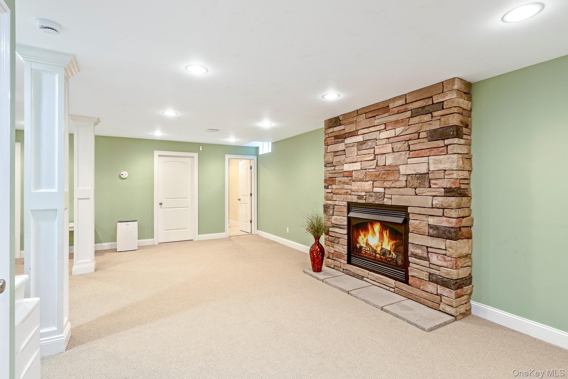4 Martin Avenue Shoreham, NY 11786 - Photo 29 of 50 a view of empty room with fireplace and fan