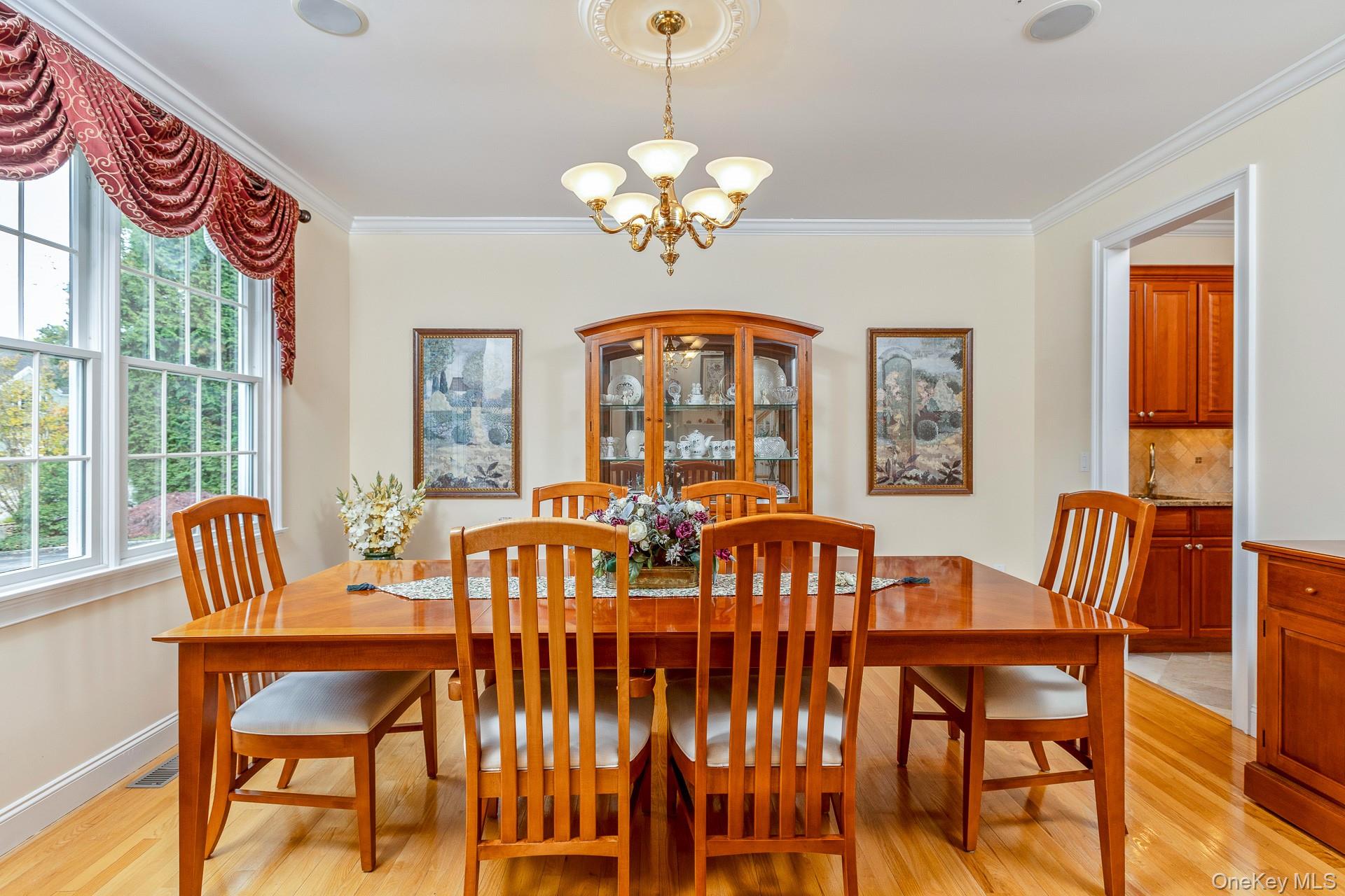 4 Martin Avenue Shoreham, NY 11786 - Photo 5 of 50 a view of a dining room with furniture a chandelier and wooden floor