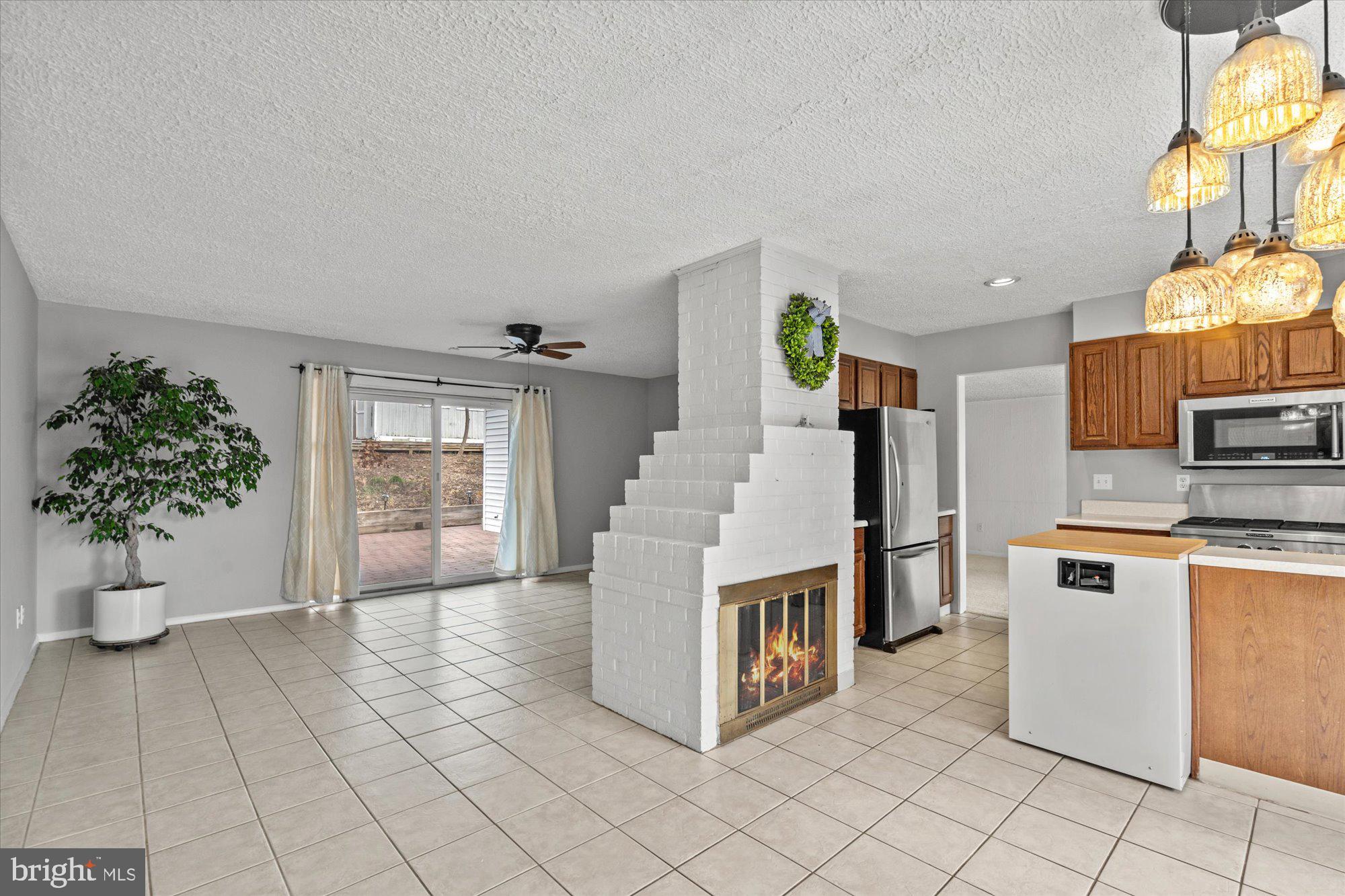 7407 Exmore Street Springfield, VA 22150 - Photo 4 of 36 Enter into the Dining/Kitchen w/ gas fireplace