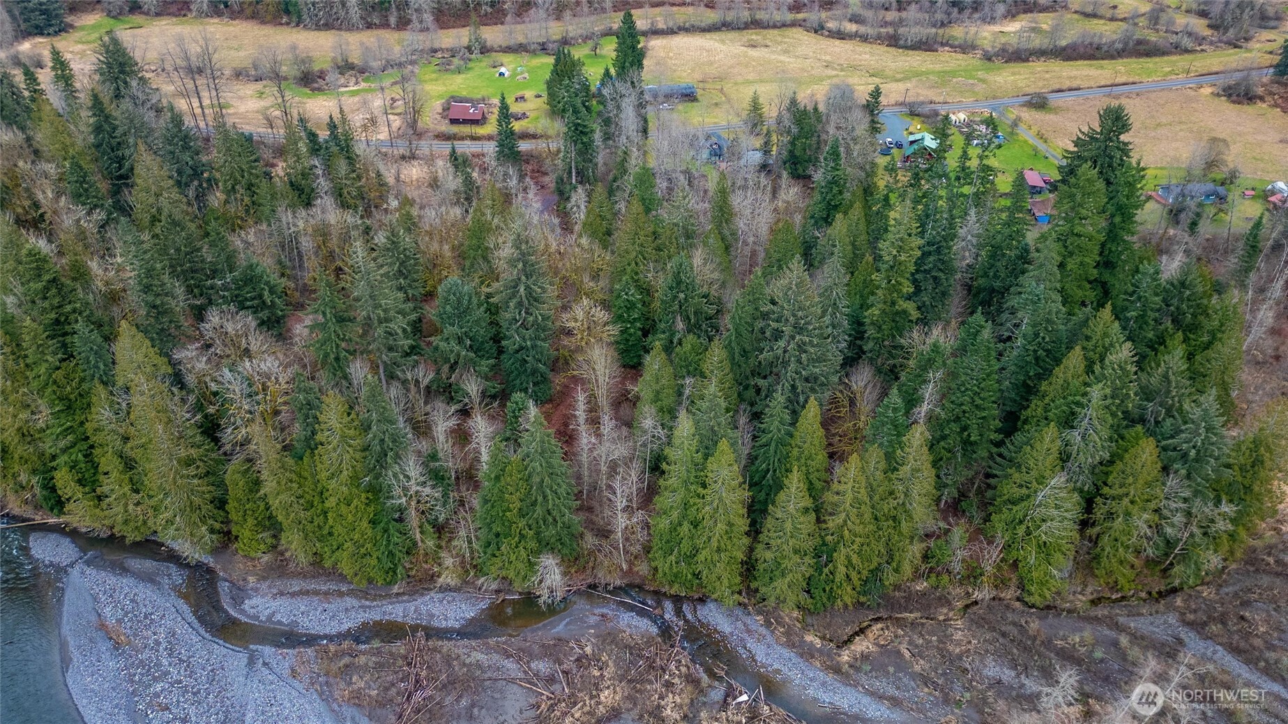 0 Mosquito Lake Road Deming, WA 98244 - Photo 19 of 22 a view of a lake with a building in the background