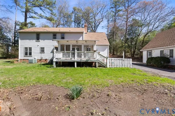 a front view of a house with a yard table and chairs