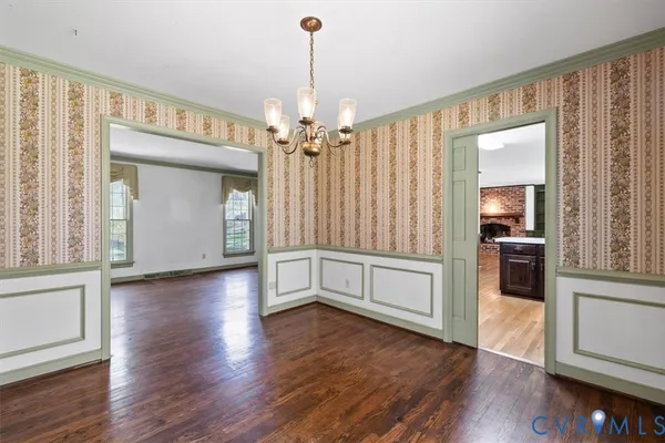 a view of a kitchen with a dishwasher cabinets and wooden floor