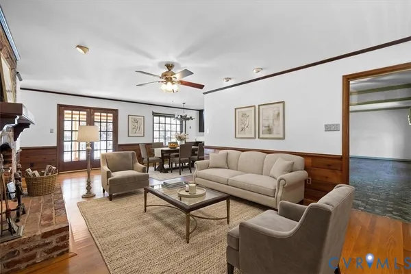 a living room with furniture a table and a window