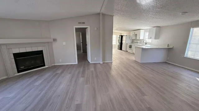 a view of kitchen and wooden floor