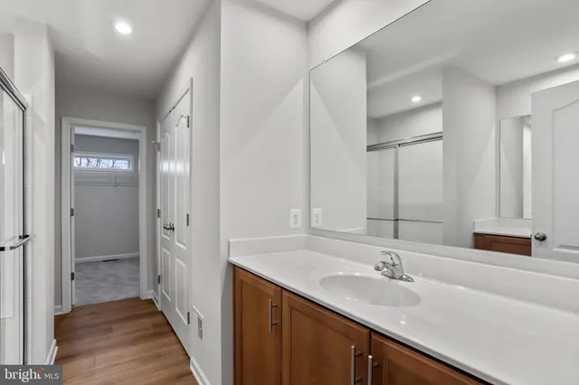 a bathroom with a double vanity sink and mirror
