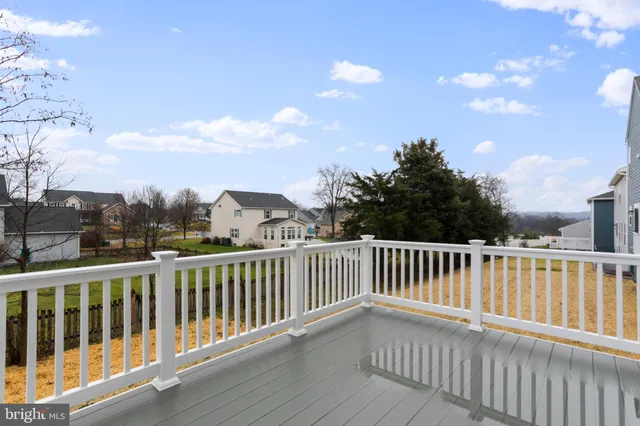 a view of a two chairs on the roof deck