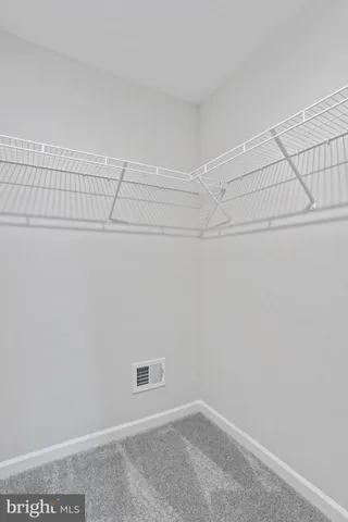 a view of a room with racks on the wall