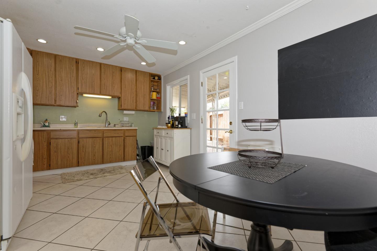 3269 Rama Drive San Jose, CA 95124 - Photo 4 of 21 a kitchen with kitchen island a sink table and chairs