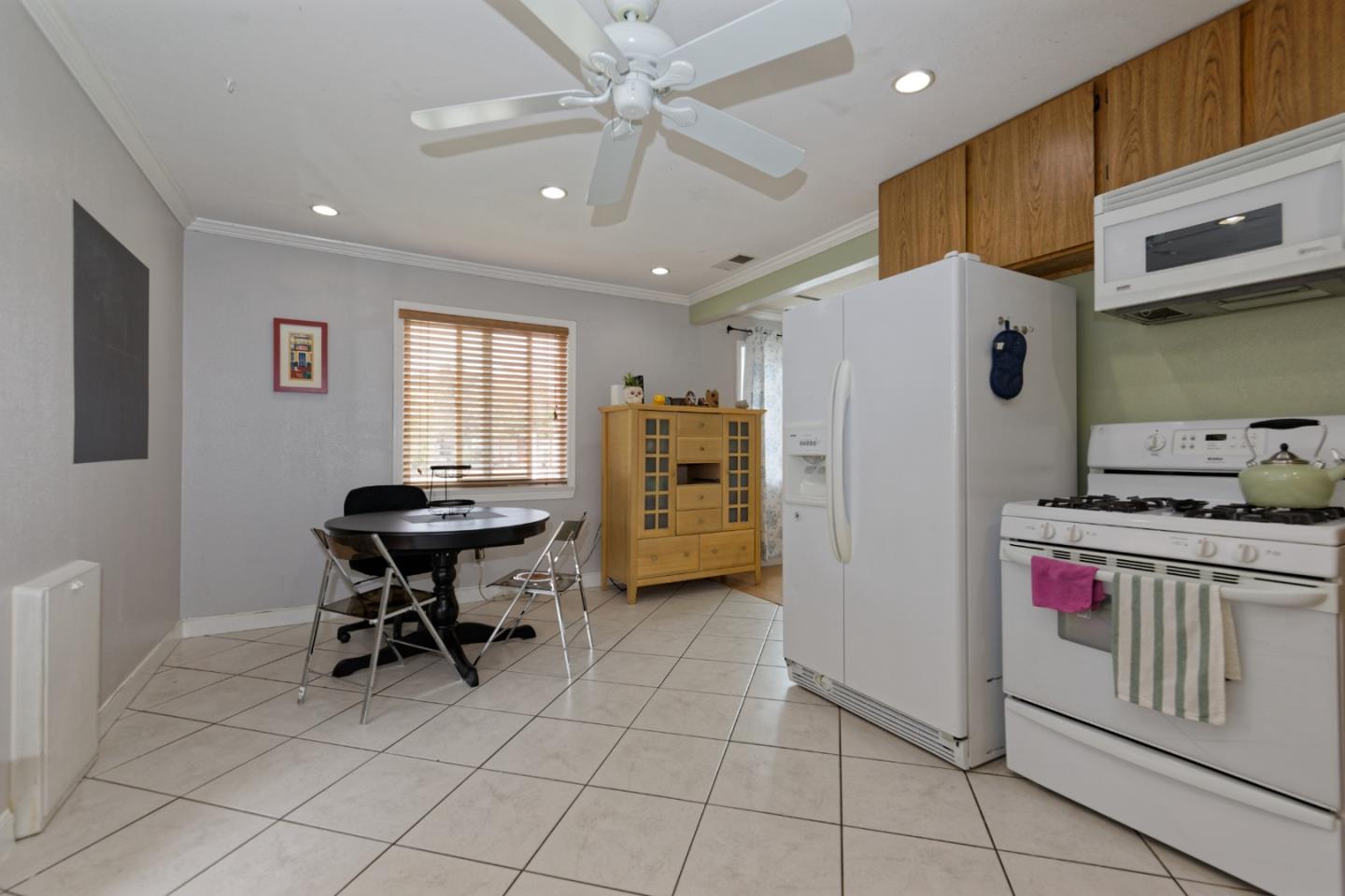 3269 Rama Drive San Jose, CA 95124 - Photo 6 of 21 a kitchen that has a lot of cabinets a sink and a refrigerator