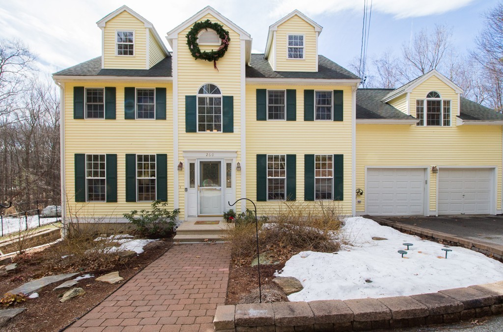 260 Manchaug Road Sutton, MA 01590 - Photo 1 of 29 a view of a brick house with many windows