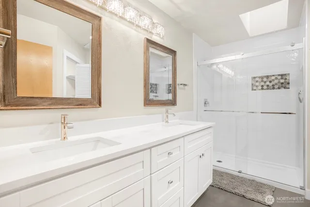 a bathroom with a sink and a mirror