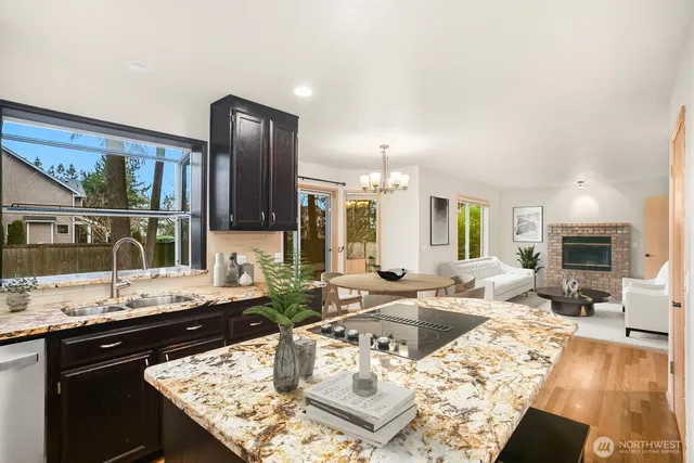 a view of a kitchen island furniture microwave and wooden floor