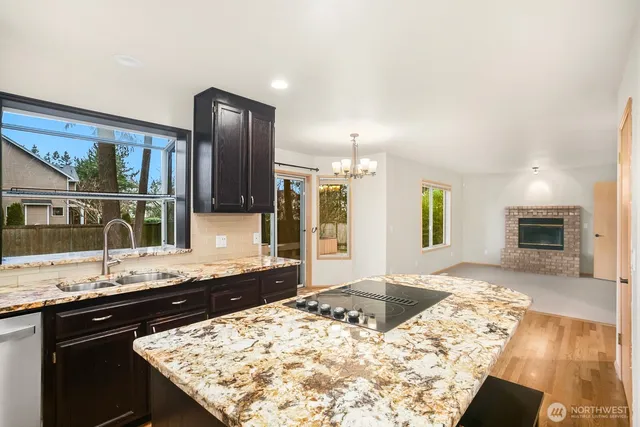 a kitchen with a sink and a wooden cabinets
