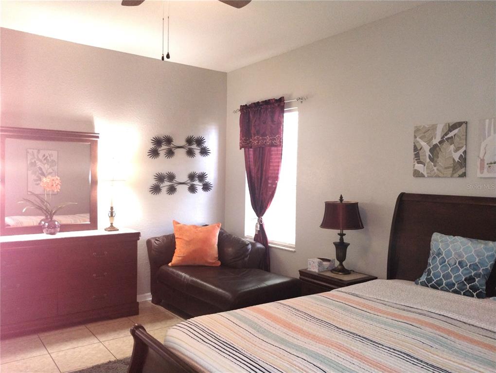 219 Cloverdale Road Winter Haven, FL 33884 - Photo 11 of 19 a bedroom with bed and window