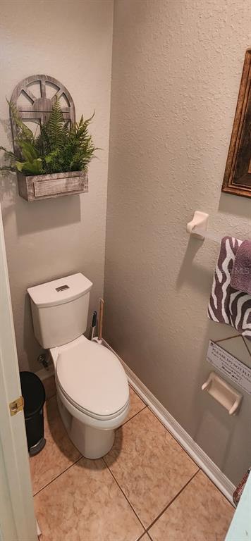 219 Cloverdale Road Winter Haven, FL 33884 - Photo 13 of 19 a bathroom with a toilet and a mirror