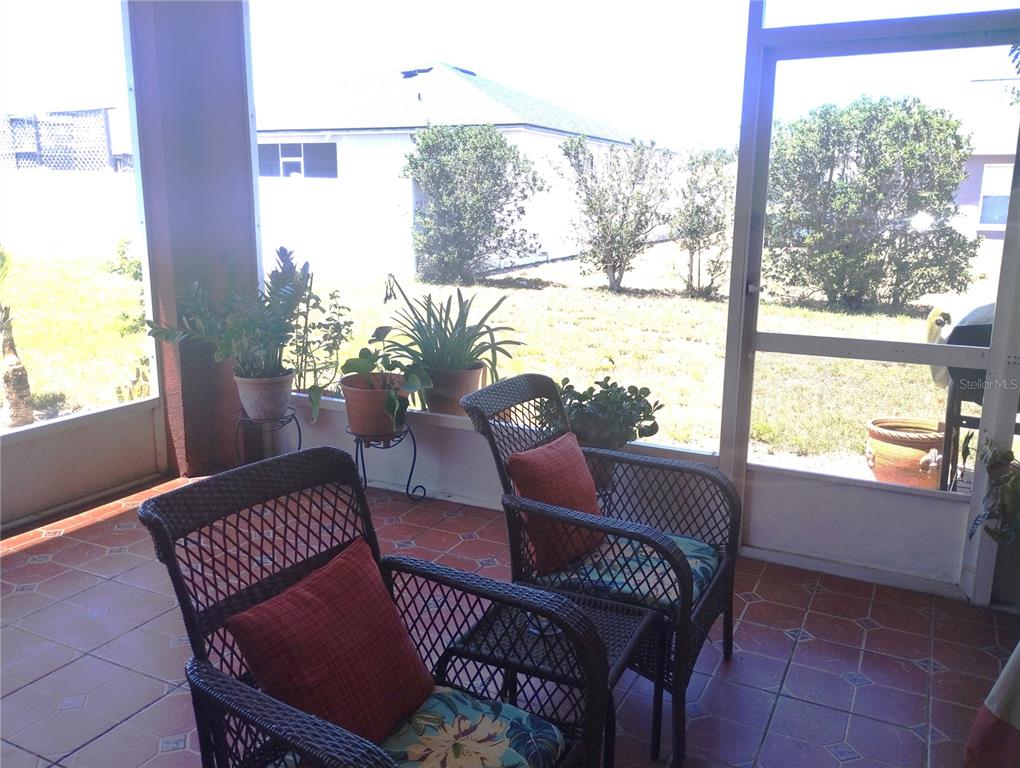 219 Cloverdale Road Winter Haven, FL 33884 - Photo 19 of 19 a view of a dining room with furniture window and outside view