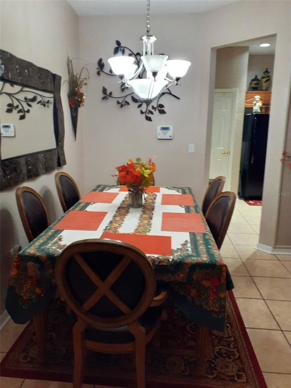 219 Cloverdale Road Winter Haven, FL 33884 - Photo 7 of 19 a bedroom with a bed and ceiling fan