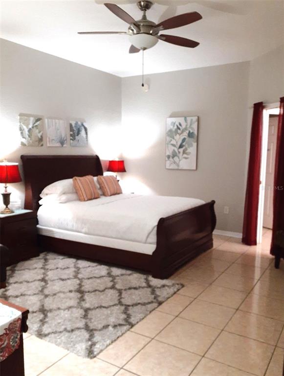 219 Cloverdale Road Winter Haven, FL 33884 - Photo 10 of 19 a bedroom with a bed and a dresser