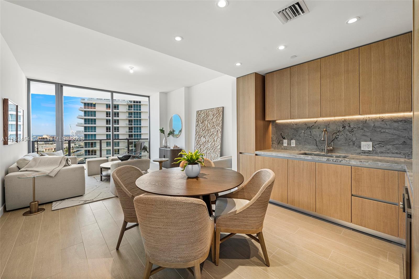 500 Alton Road, Unit 1904 Miami Beach, FL 33139 - Photo 1 of 31 a dining room with furniture a window and appliances