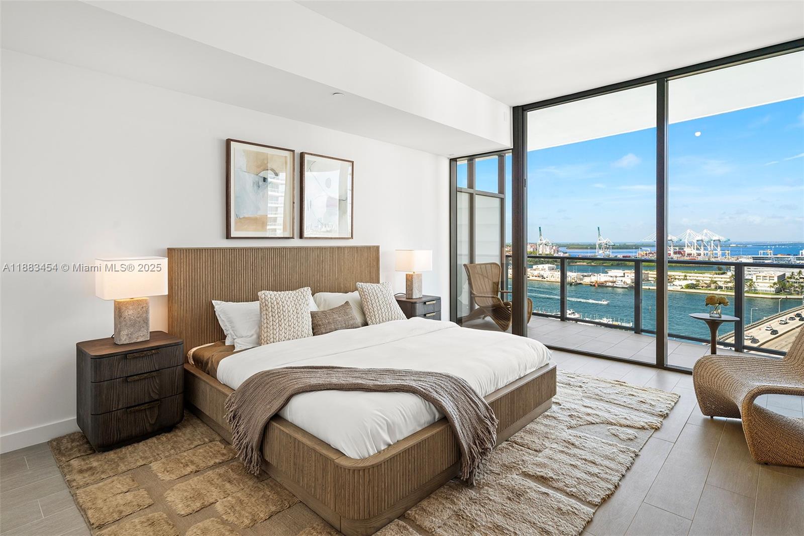 500 Alton Road, Unit 1904 Miami Beach, FL 33139 - Photo 11 of 31 a bedroom with a large bed and a large window
