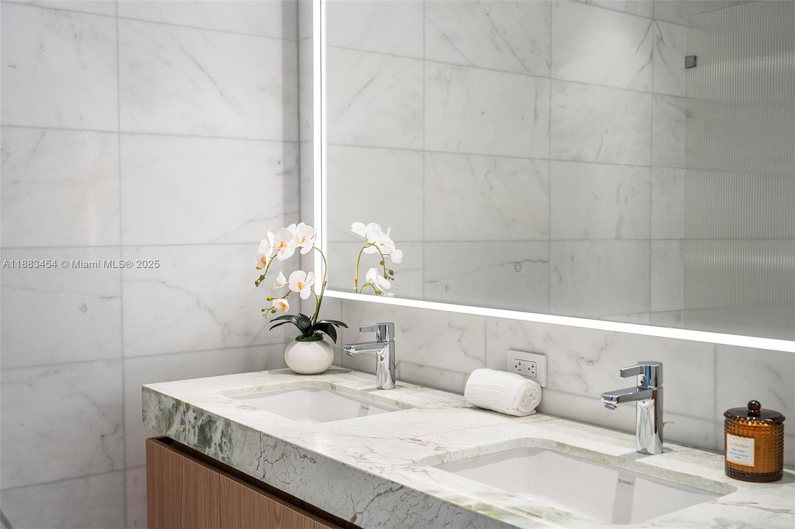 500 Alton Road, Unit 1904 Miami Beach, FL 33139 - Photo 22 of 31 a bathroom with a sink and vanity