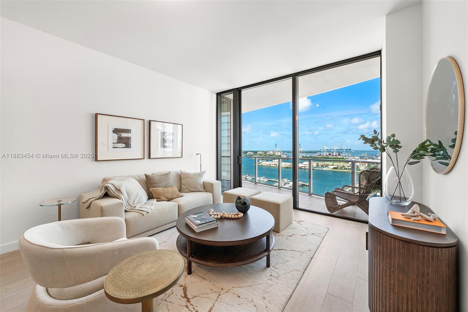 500 Alton Road, Unit 1904 Miami Beach, FL 33139 - Photo 27 of 31 a living room with furniture and a large window