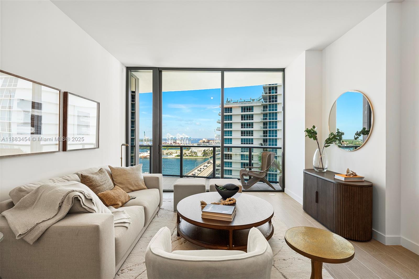 500 Alton Road, Unit 1904 Miami Beach, FL 33139 - Photo 3 of 31 a living room with furniture and a large window