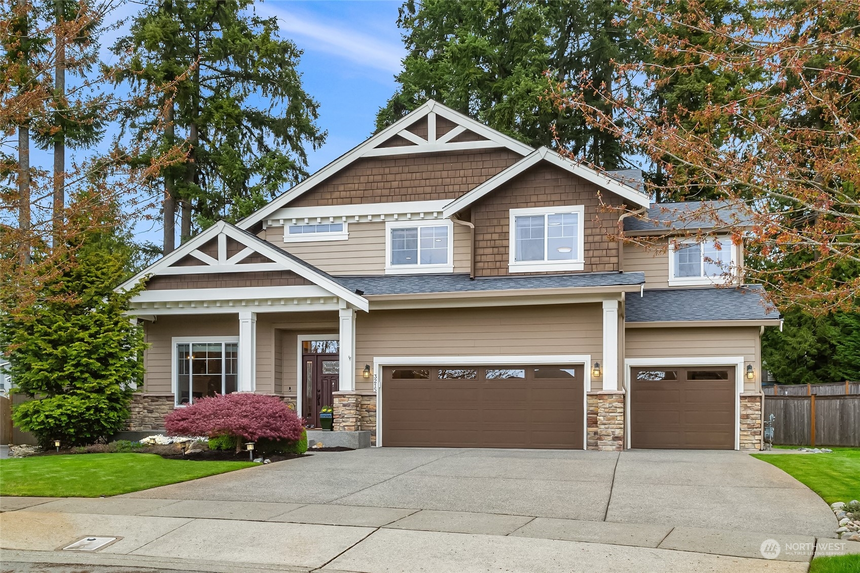 3215 217th Place Southeast Bothell, WA 98021 - Photo 1 of 30 a front view of a house with a garden and garage
