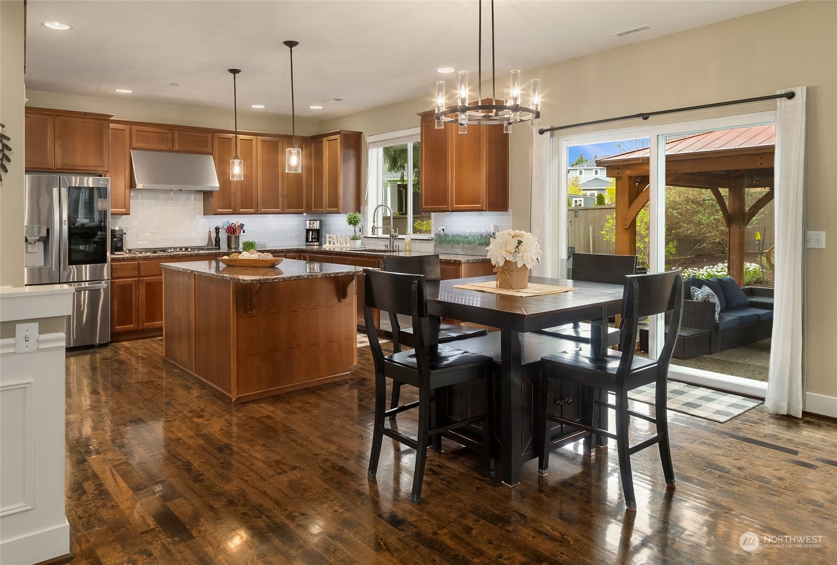 3215 217th Place Southeast Bothell, WA 98021 - Photo 11 of 30 a dining table with chairs and kitchen view