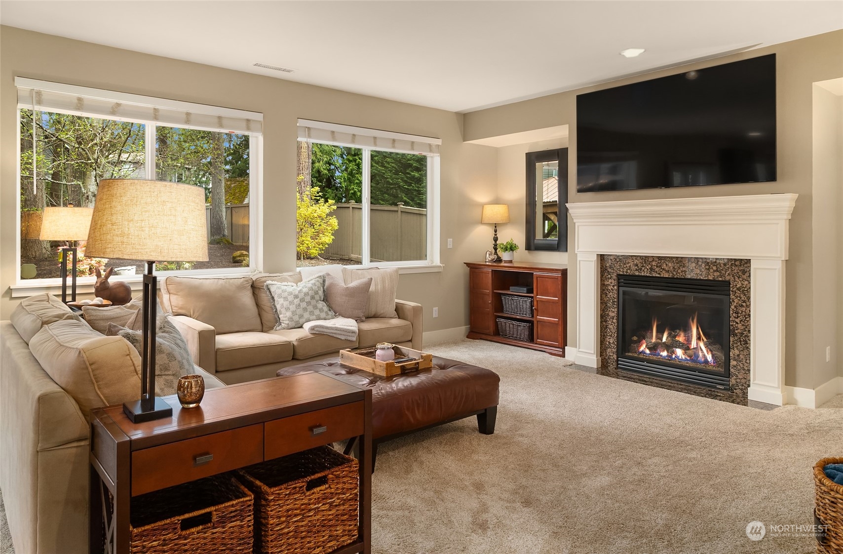 3215 217th Place Southeast Bothell, WA 98021 - Photo 15 of 30 a living room with furniture a fireplace and a flat screen tv