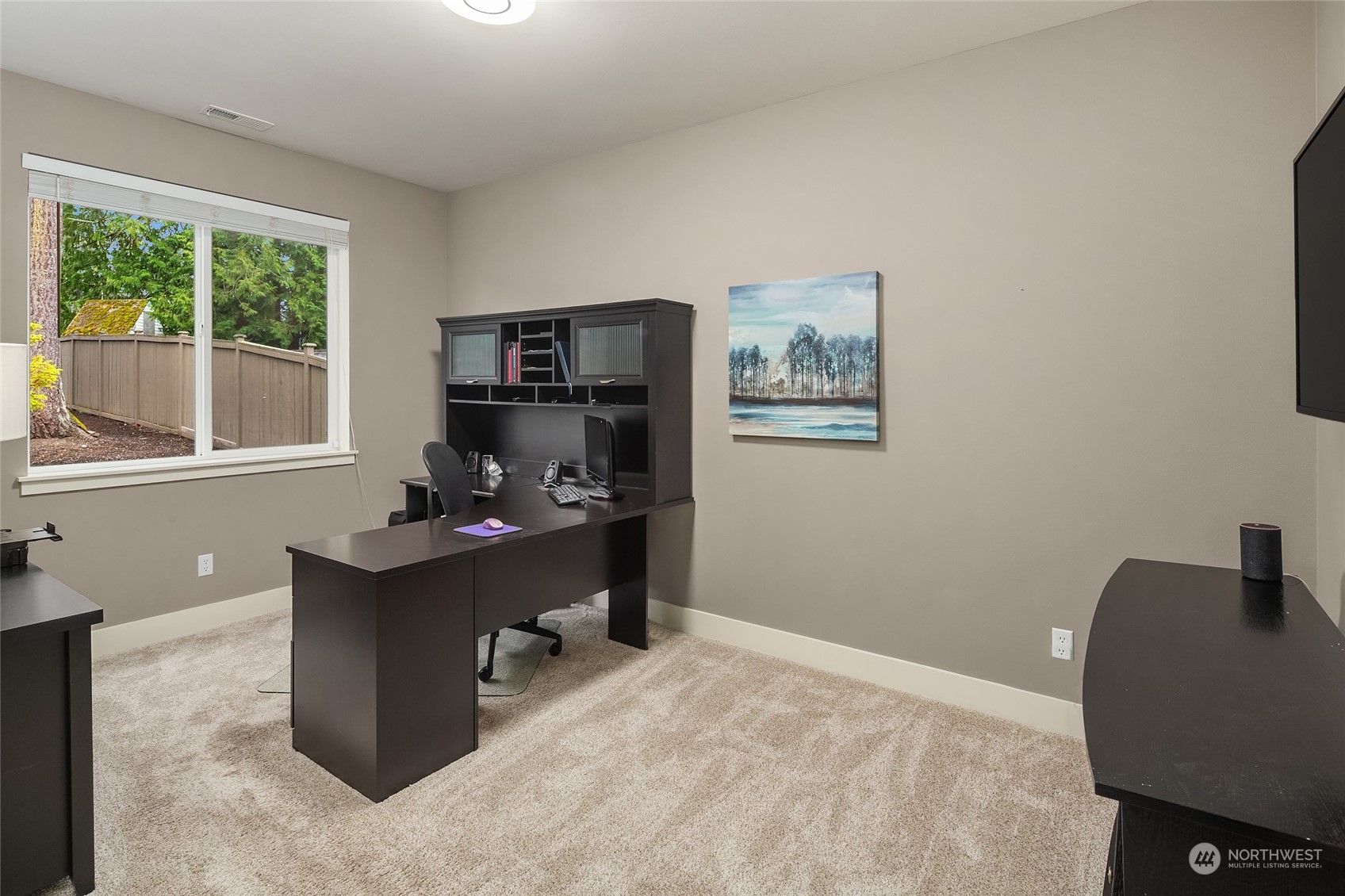 3215 217th Place Southeast Bothell, WA 98021 - Photo 17 of 30 a view of a workspace with furniture and a window