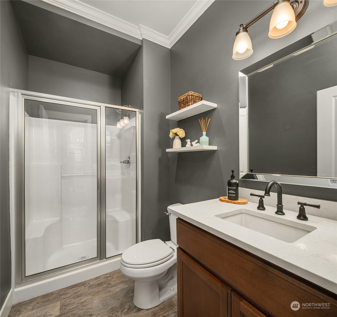 3215 217th Place Southeast Bothell, WA 98021 - Photo 18 of 30 a bathroom with a sink a toilet and shower