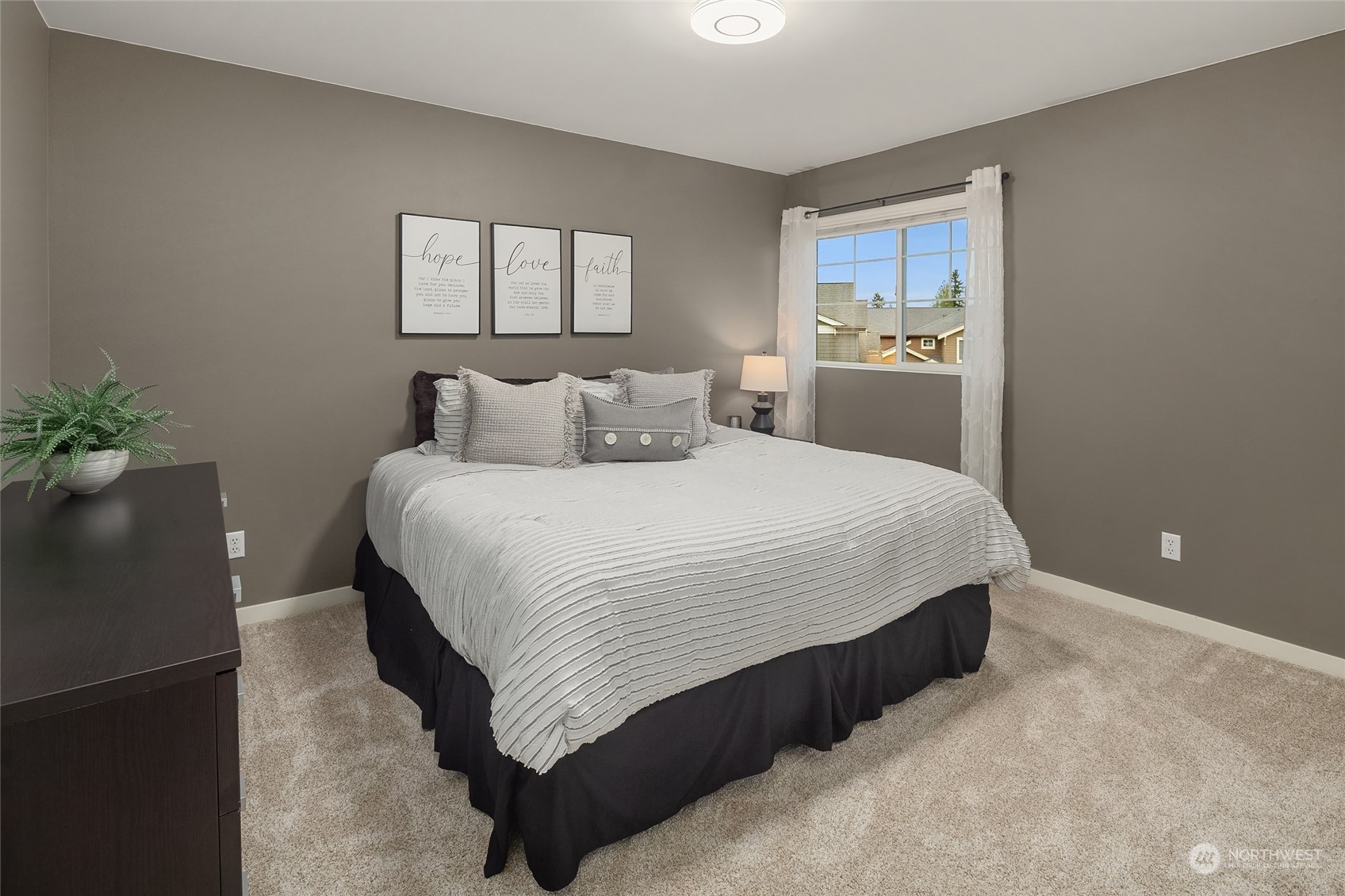 3215 217th Place Southeast Bothell, WA 98021 - Photo 26 of 30 a bedroom with a bed and a potted plant