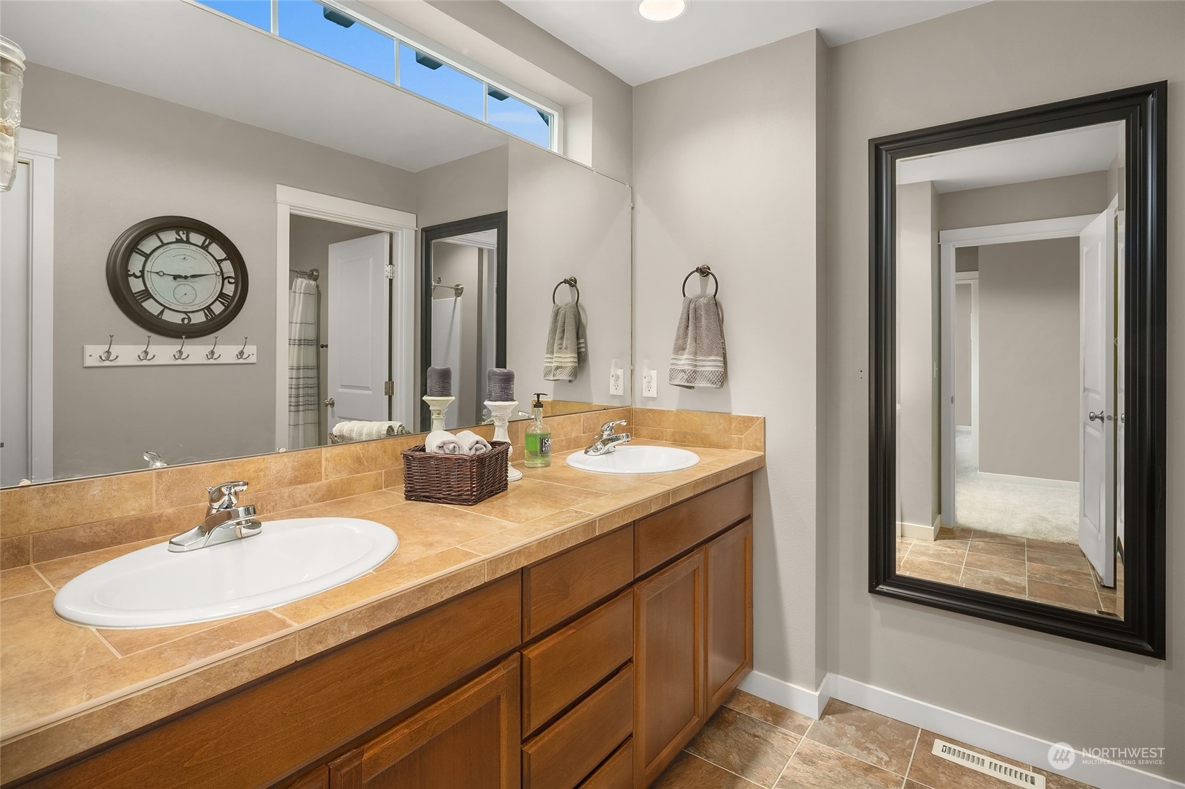 3215 217th Place Southeast Bothell, WA 98021 - Photo 27 of 30 a bathroom with a sink and a mirror