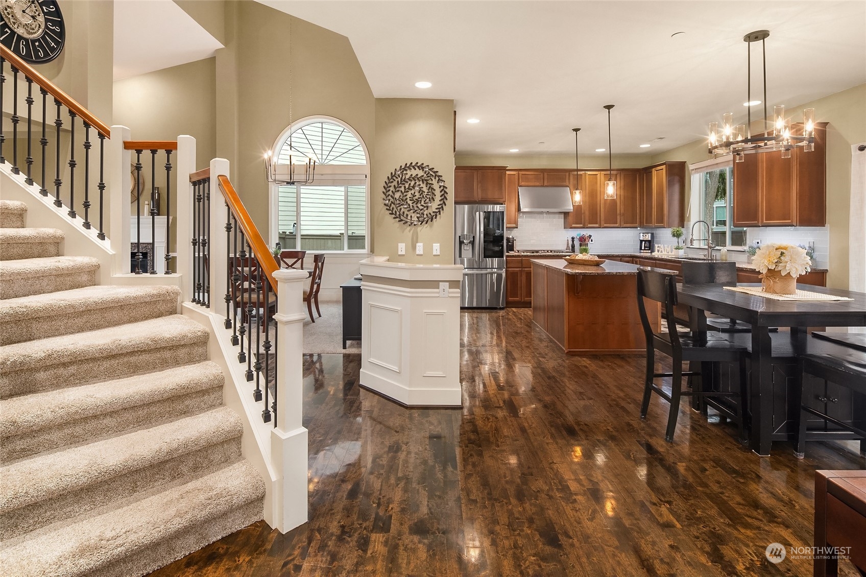 3215 217th Place Southeast Bothell, WA 98021 - Photo 8 of 30 a view of a dining room with furniture a chandelier and wooden floor