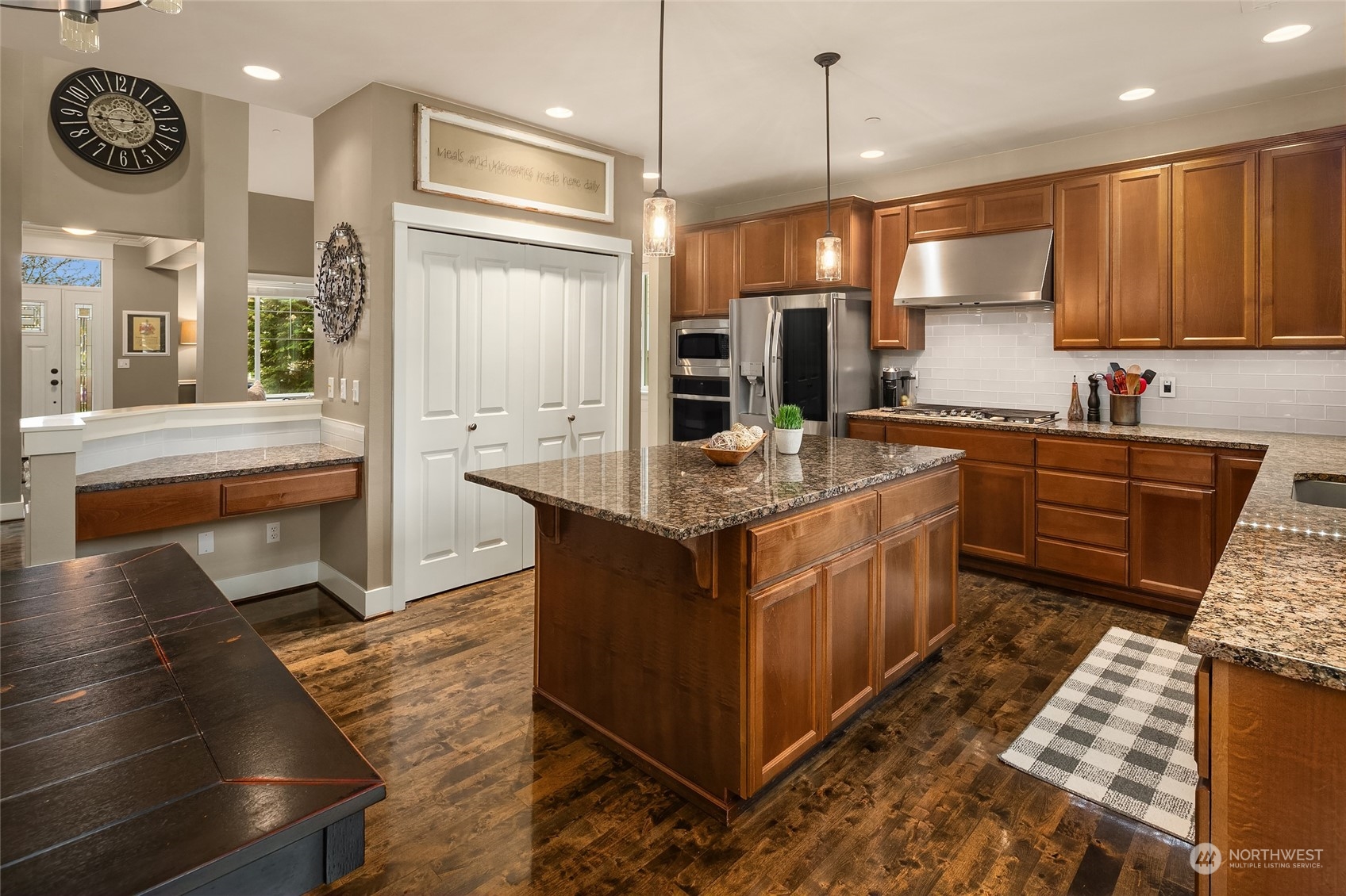 3215 217th Place Southeast Bothell, WA 98021 - Photo 9 of 30 a kitchen with stainless steel appliances granite countertop a stove a sink and a refrigerator