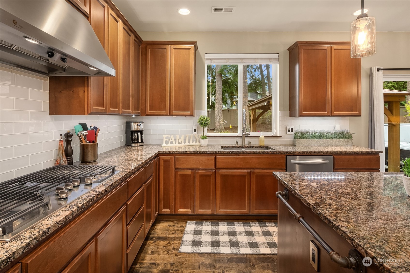 3215 217th Place Southeast Bothell, WA 98021 - Photo 10 of 30 a kitchen with a stove sink and cabinets