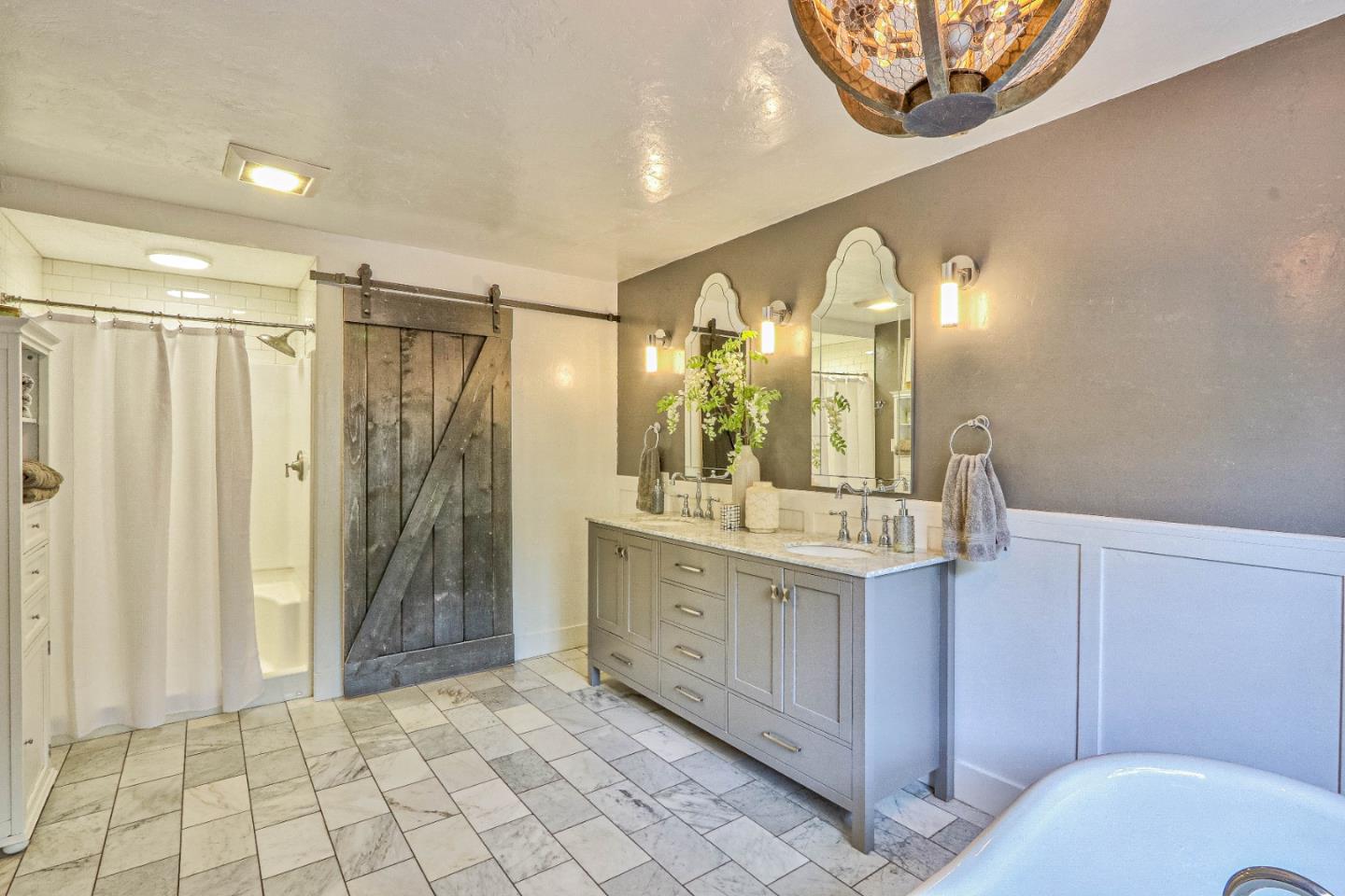 180 San Benancio Road Salinas, CA 93908 - Photo 17 of 27 a bathroom with a mirror a sink and a shower