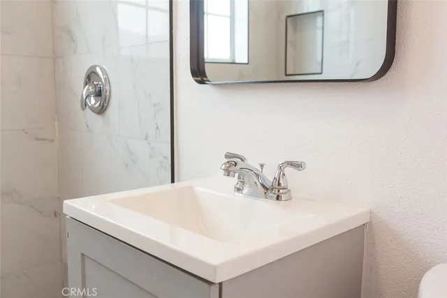 a bathroom with a sink and a mirror