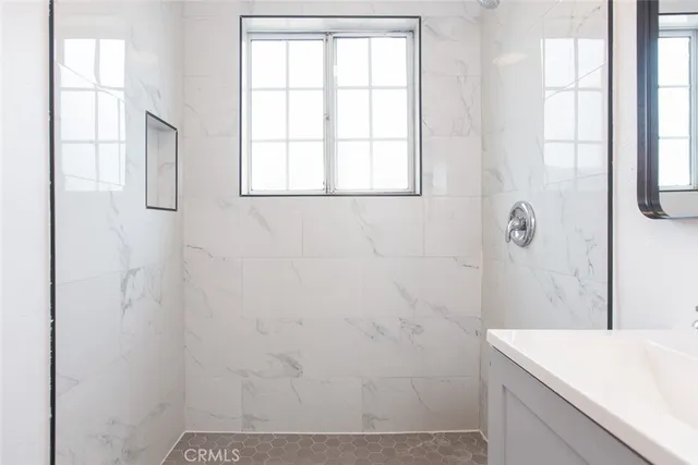 a bathroom with a sink and a shower