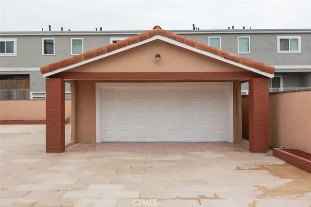a view of garage and yard
