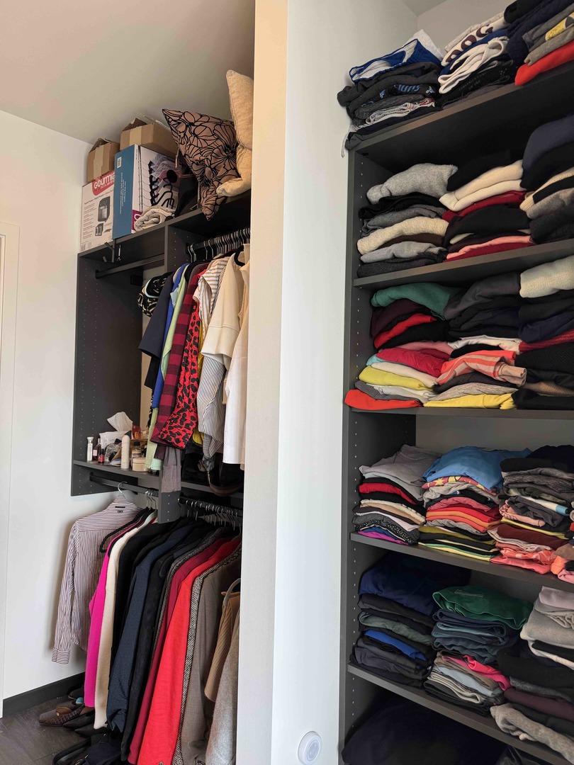 Undisclosed Address Chicago, IL 60607 - Photo 15 of 28 a view of walk in closet with clothes and shoes