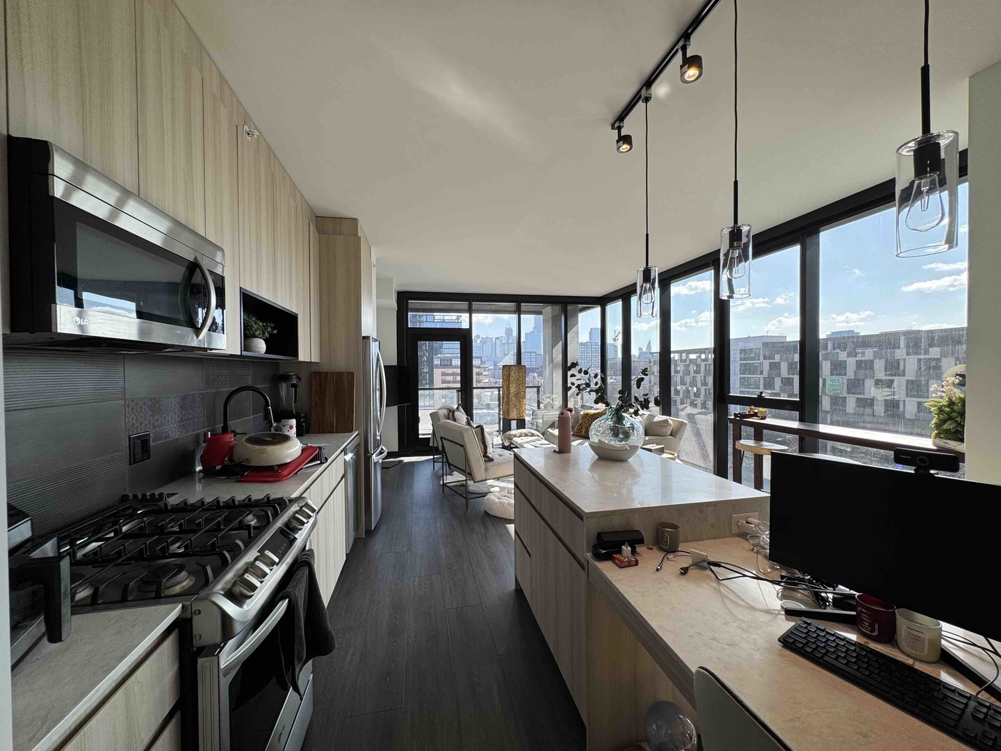 Undisclosed Address Chicago, IL 60607 - Photo 4 of 28 a kitchen with stainless steel appliances a stove and a view of living room