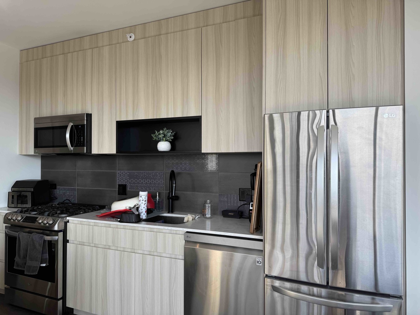 Undisclosed Address Chicago, IL 60607 - Photo 9 of 28 a kitchen with stainless steel appliances granite countertop a refrigerator and a stove top oven