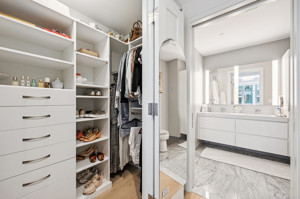 133 Seaport Boulevard, Unit 823 Boston, MA 02210 - Photo 15 of 31 a view of walk in closet and bedroom