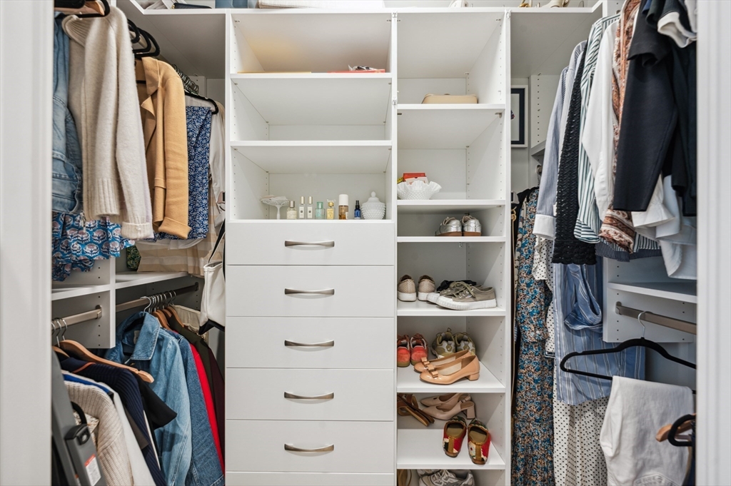 133 Seaport Boulevard, Unit 823 Boston, MA 02210 - Photo 16 of 31 a view of walk in closet with clothes and shoes