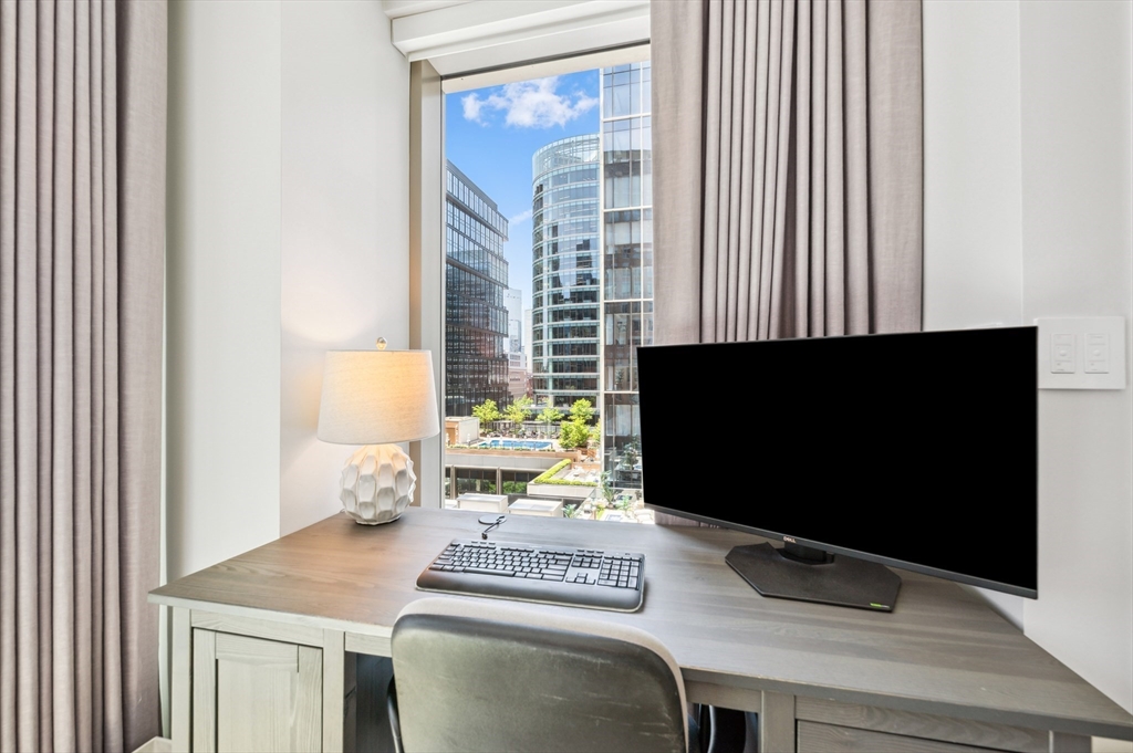 133 Seaport Boulevard, Unit 823 Boston, MA 02210 - Photo 18 of 31 a kitchen with a stove and a microwave