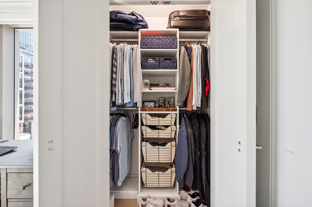 133 Seaport Boulevard, Unit 823 Boston, MA 02210 - Photo 19 of 31 a view of walk in closet with clothes