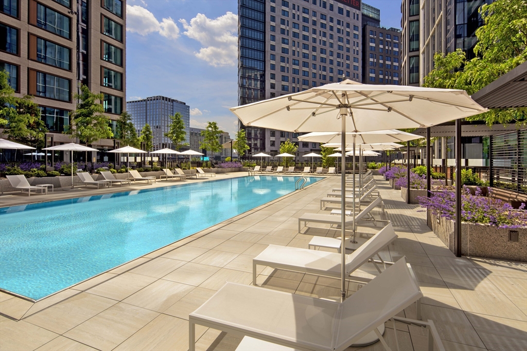 133 Seaport Boulevard, Unit 823 Boston, MA 02210 - Photo 24 of 31 a view of a swimming pool with a lounge chairs
